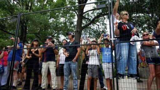 Spectators line the track to watch IndyCars during a practice session for the Freedom 250 Grand Prix in Washington