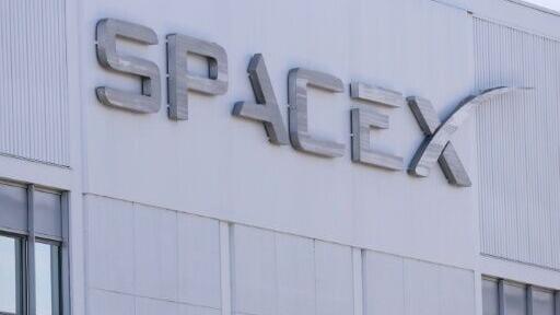 SpaceX signage is displayed outside a Space Exploration Technologies Corp. facility in Hawthorne, California in March 2026
