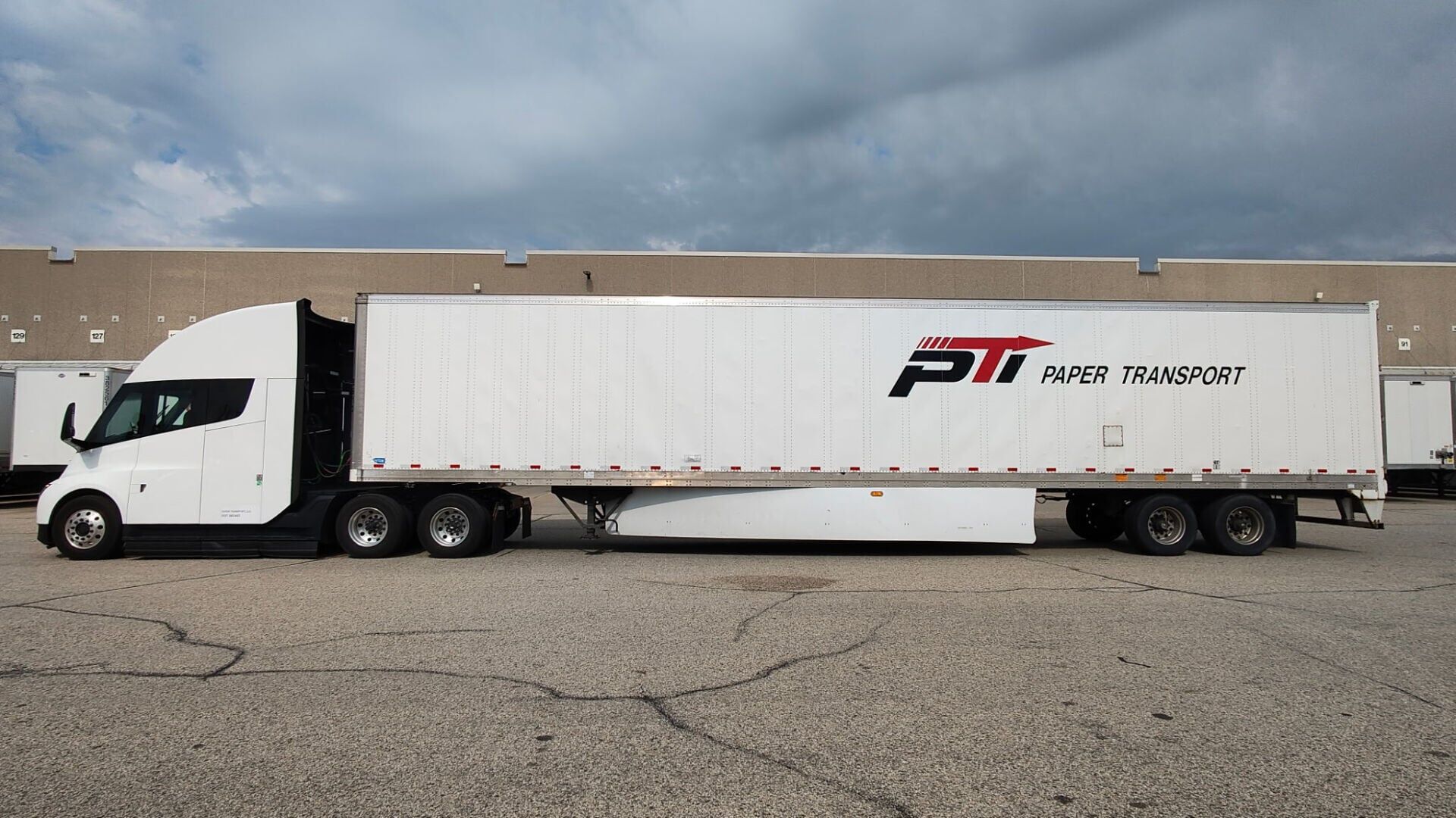Tesla Semi Long Range with a Paper Transport trailer during evaluation in dedicated operations in the Chicago market (driver's side view).