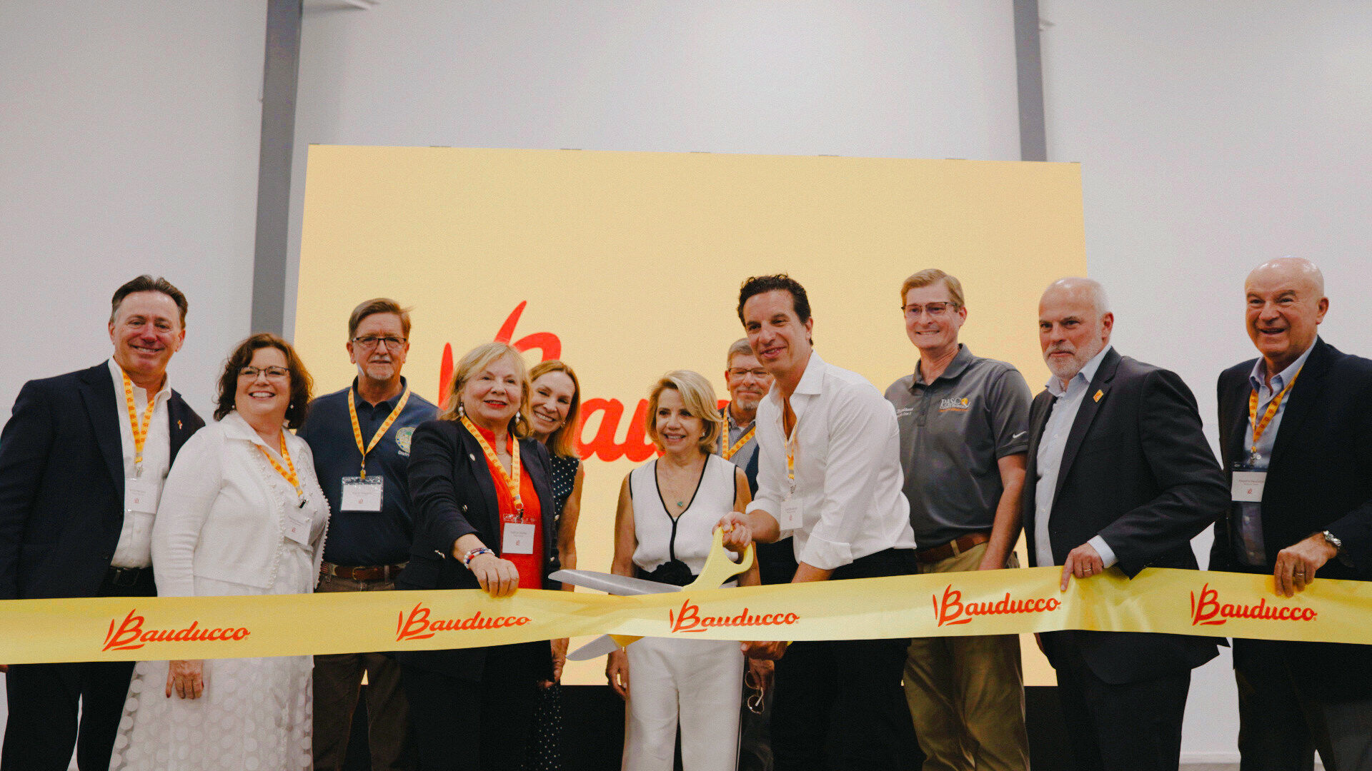 Bauducco International Business Unit CEO and Bauducco family members are joined by the Zephyrhills Mayor and state and local officials for a ribbon cutting celebrating the grand opening of Bauducco's largest U.S. manufacturing facility in Zephyrhills, F...