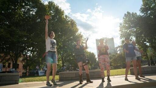 People cheer at a protest against the G20 finance ministers and central bank governors’ meeting in Asheville, North Carolina