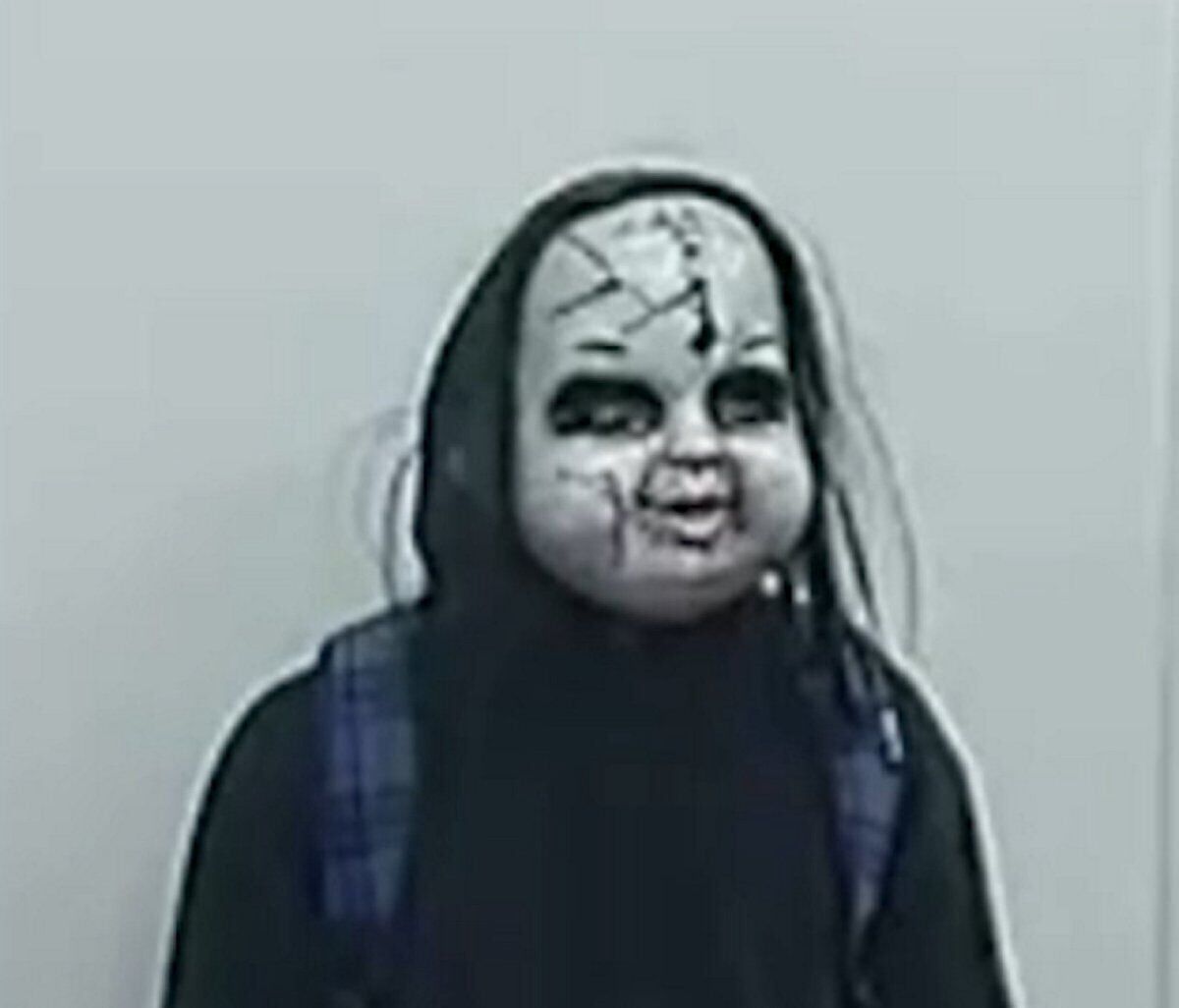 Watch moment man in Chucky mask chases woman