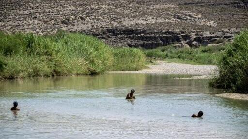 Tourists swim in the Rio Grande, on the US-Mexico border inside Big Bend National Park