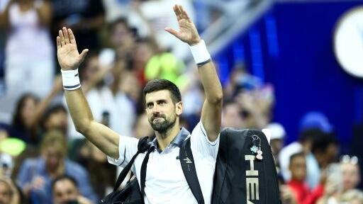 Serbia's Novak Djokovic receives treatment during his five-set first-round loss to Mariano Navone at the US Open