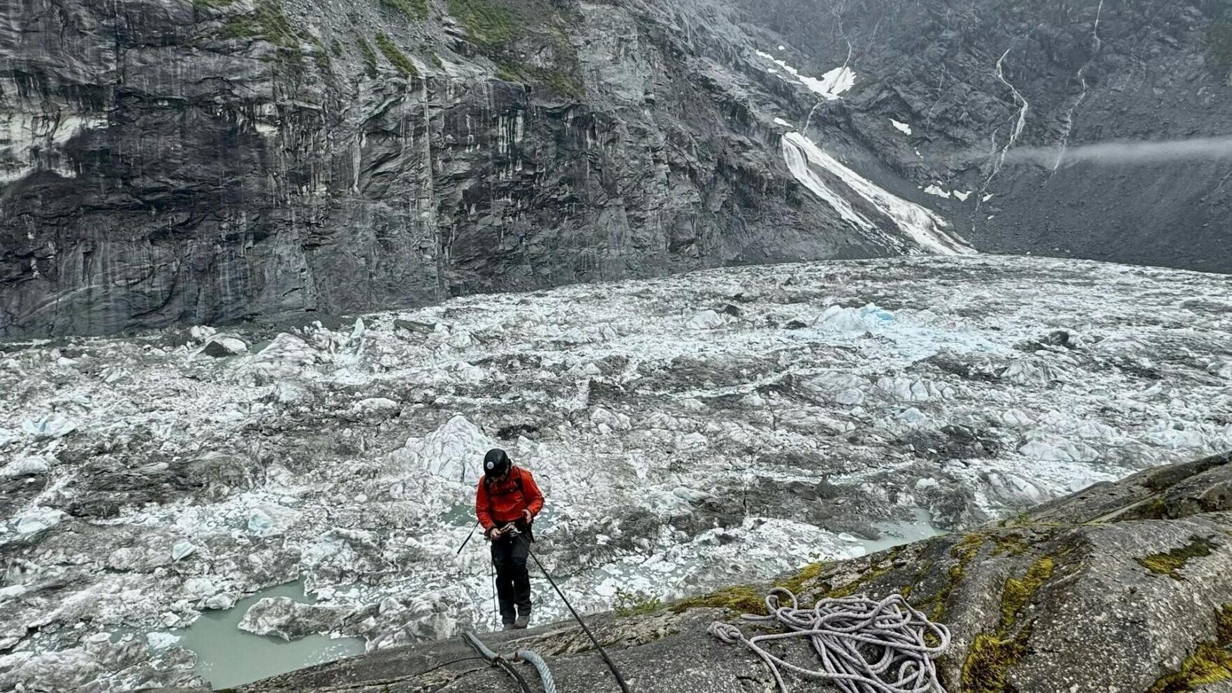 U.S. Geological Survey staff check monitoring equipment in Suicide Basin in June 2025. By August, the basin had filled with meltwater.