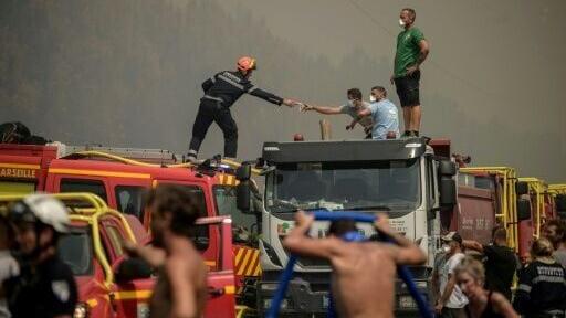 Fire trucks, tankers and hefty vehicles laden with cisterns stretched for several hundred metres along the road