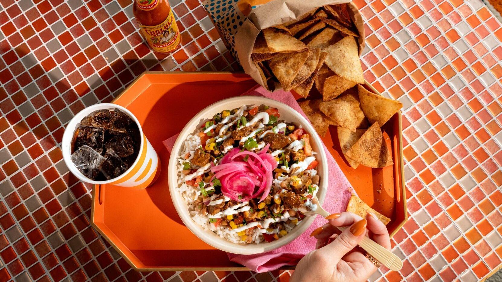 QDOBA kicks off summer with new Spicy Tequila Lime Steak and Churro Chips.