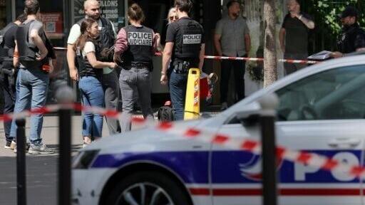 The attacker was yielding two kitchen knives, the authorities said