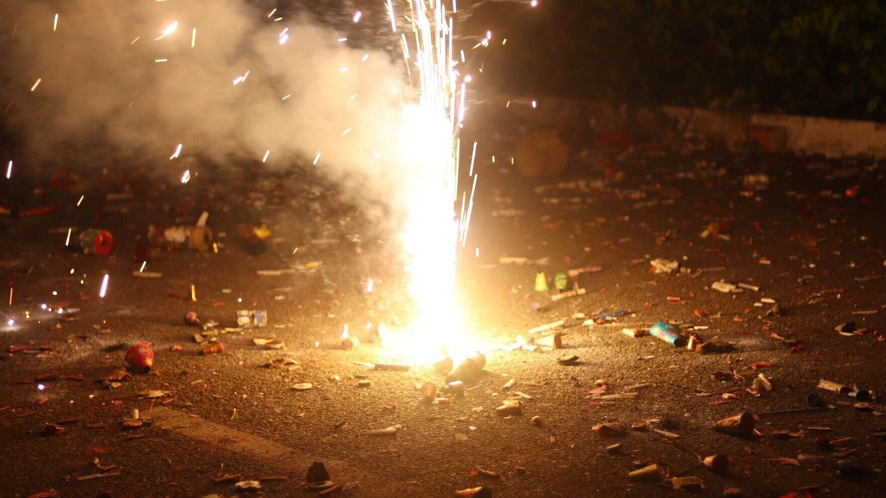 Cracker Burning and Sparkles In Dark Closeup