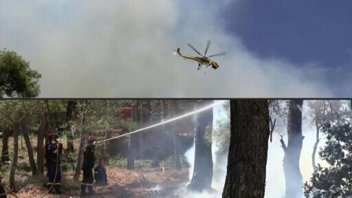 Firefighters battle blazes in the hills of Greece's Porto Germeno