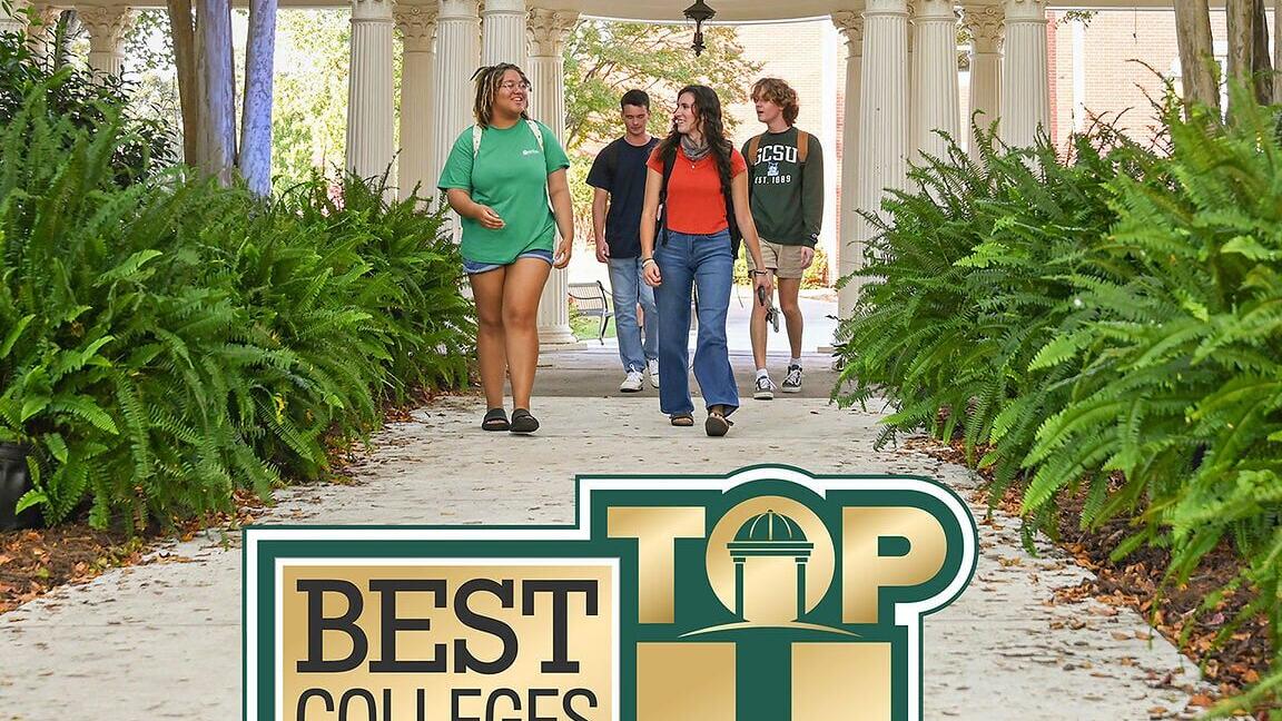 Students walking though the front campus pergola at GCSU, with the US News Top 4 graphic.