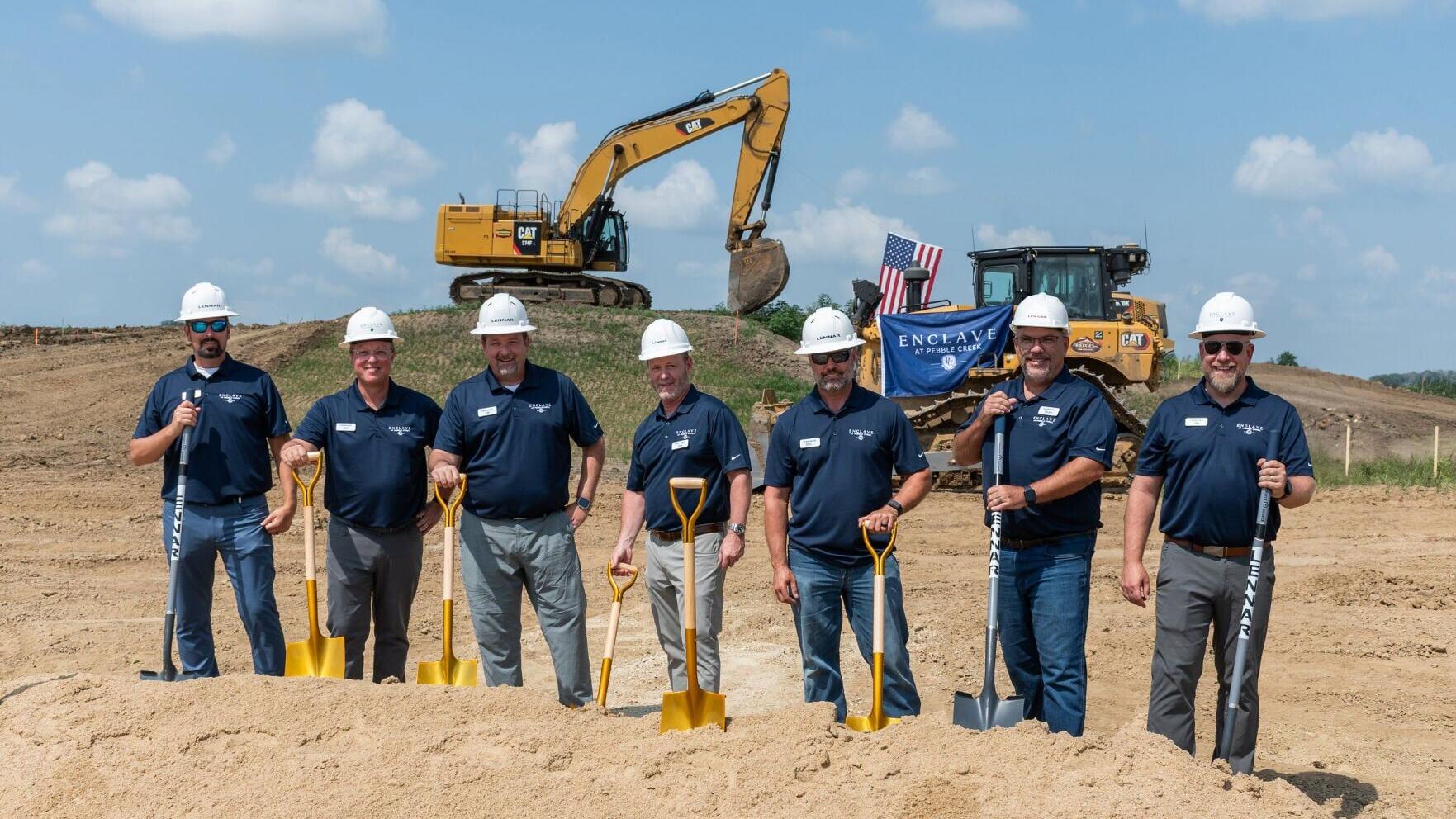 Associates from Lennar's Minnesota Division break ground at the Enclave at Pebble Creek ceremonial groundbreaking.