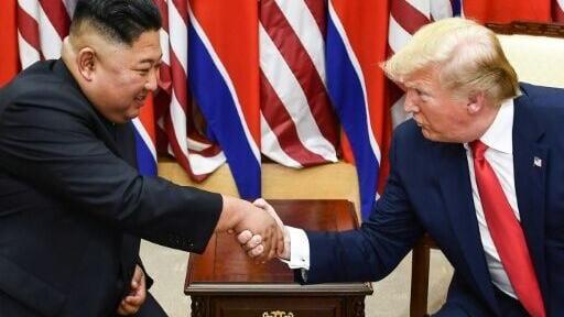 North Korea's leader Kim Jong Un (L) and US President Donald Trump meet in 2019