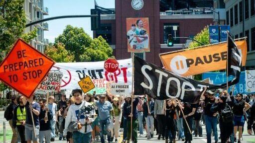 Demonstrators take part in a 'Stop the AI Race' protest march held in San Francisco in July