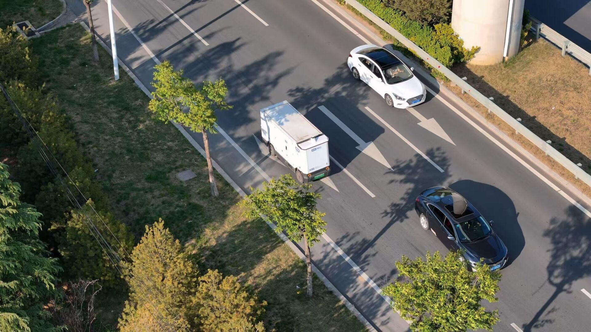 A Neolix autonomous delivery vehicle operating on public urban roads.