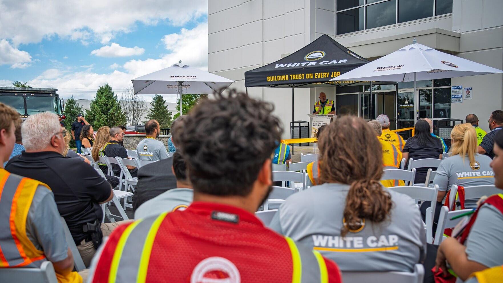 Community partners and employees enjoy the ceremony