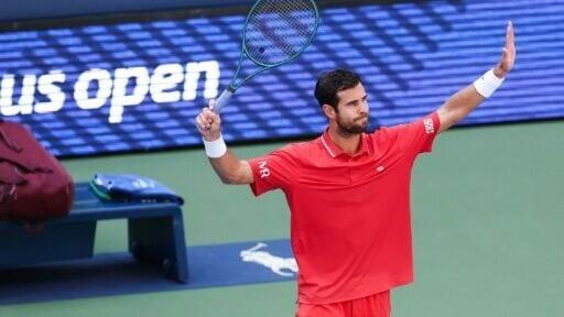 Russia's Karen Khachanov celebrates after upsetting third-seeded Felix Auger-Aliassime in the second round of the US Open