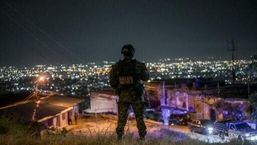Colombian police patrol the streets of Cali prior to the presidential inauguration