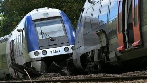 One carriage tipped onto its side while four others left the tracks