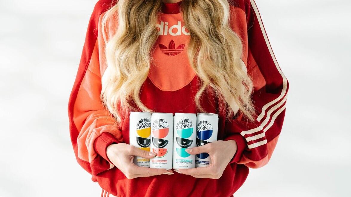 Professional basketball player Sophie Cunningham enjoys Once Upon A Coconut's premium coconut water, highlighting the brand's commitment to clean ingredients, refreshing taste, and everyday hydration.