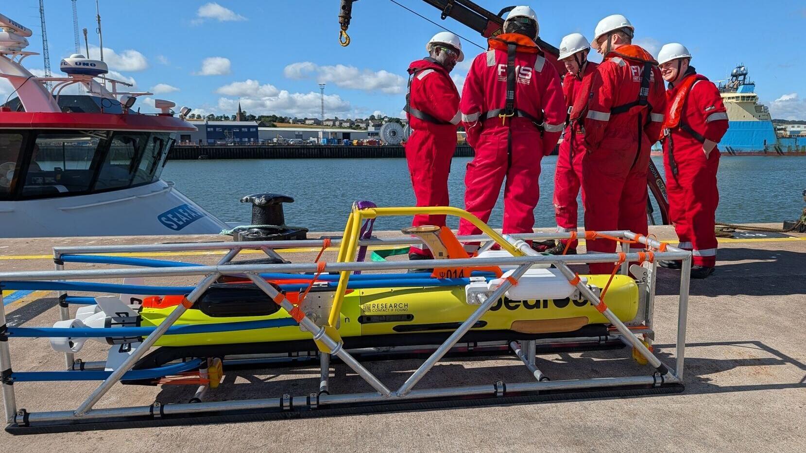 FMS operators preparing for on-water training with Bedrock's autonomous underwater vehicle.