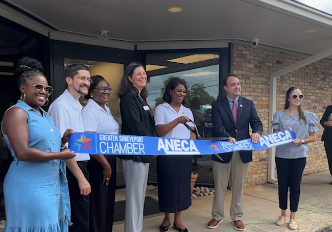 Dignitaries cutting ribbon on newly relaunched FEC
