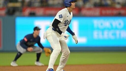 Shohei Ohtani of the Los Angeles Dodgers runs the bases in an MLB game against the Seattle Mariners