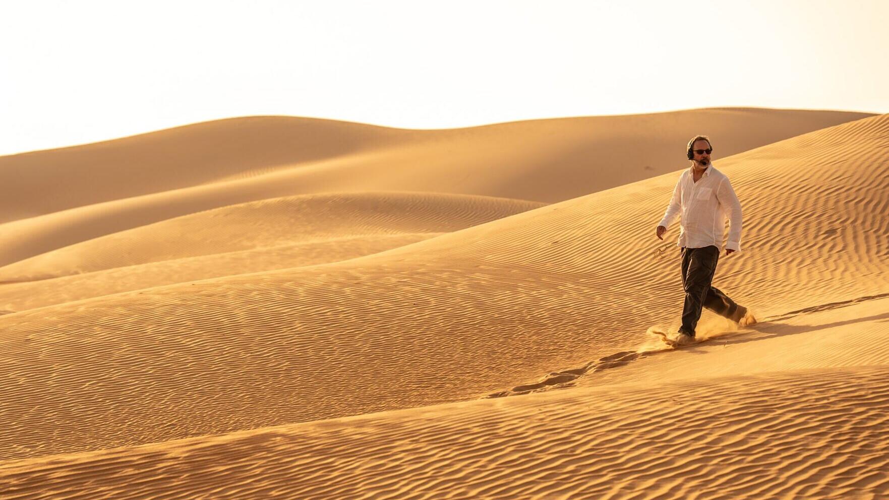Director/Writer/Producer DENIS VILLENEUVE on the set of Warner Bros. Pictures and Legendary Pictures’ action adventure “DUNE: PART THREE,” in the Liwa Desert, Abu Dhabi. A Warner Bros. Pictures release. Photo by Niko Tavernise. (PRNewsfoto/Abu Dhabi Fil...