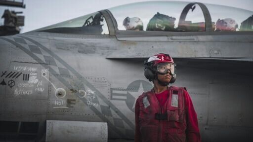 This handout picture released by the US Navy on September 13, 2026, shows a US Sailor after checking ordnance on an F/A-18 Super Hornet, attached to Strike Fighter Squadron (VFA) 102, on the flight deck of Nimitz-class aircraft carrier USS George Washin...
