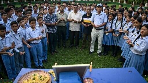 Mourners and students paid their respects to mountaineer Nirmal Purja, gathering around a framed photograph of the climber