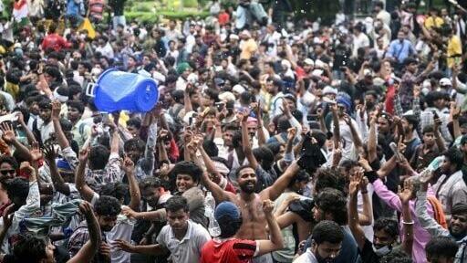 Cockroach Janta Party (CJP) supporters dance to celebrate the resignation of India's education minister Dharmendra Pradhan, at Jantar Mantar in New Delhi on July 25, 2026