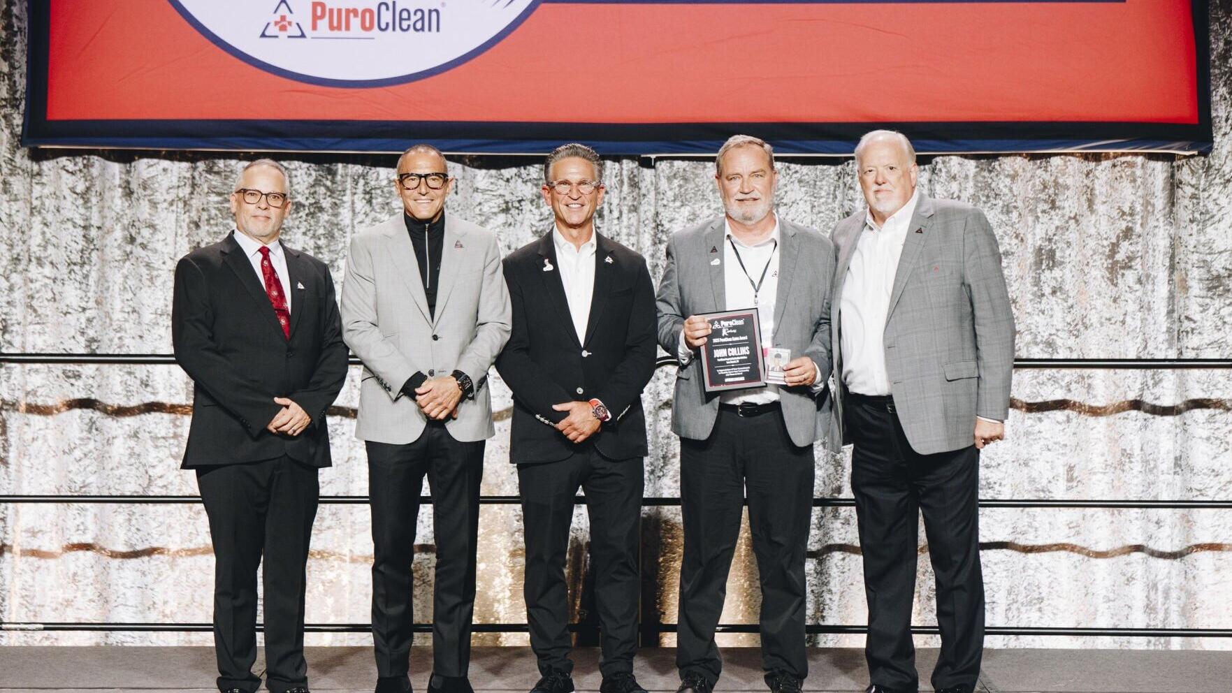From left to right: Alex Pericchi, Vice President of Marketing, Frank Torre, Vice Chairmen, Mark W. Davis, Chairman &amp; CEO, Troy Bowman, Regional Director (on behalf of John Collins), and Steve White, President