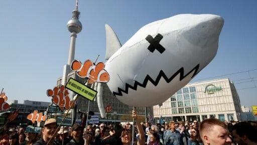 Berlin demonstrators with an inflatable 'rental shark' protest against gentrification and rising rents