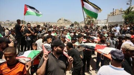 Tuesday's mass funeral was one of the largest ever organised in Gaza