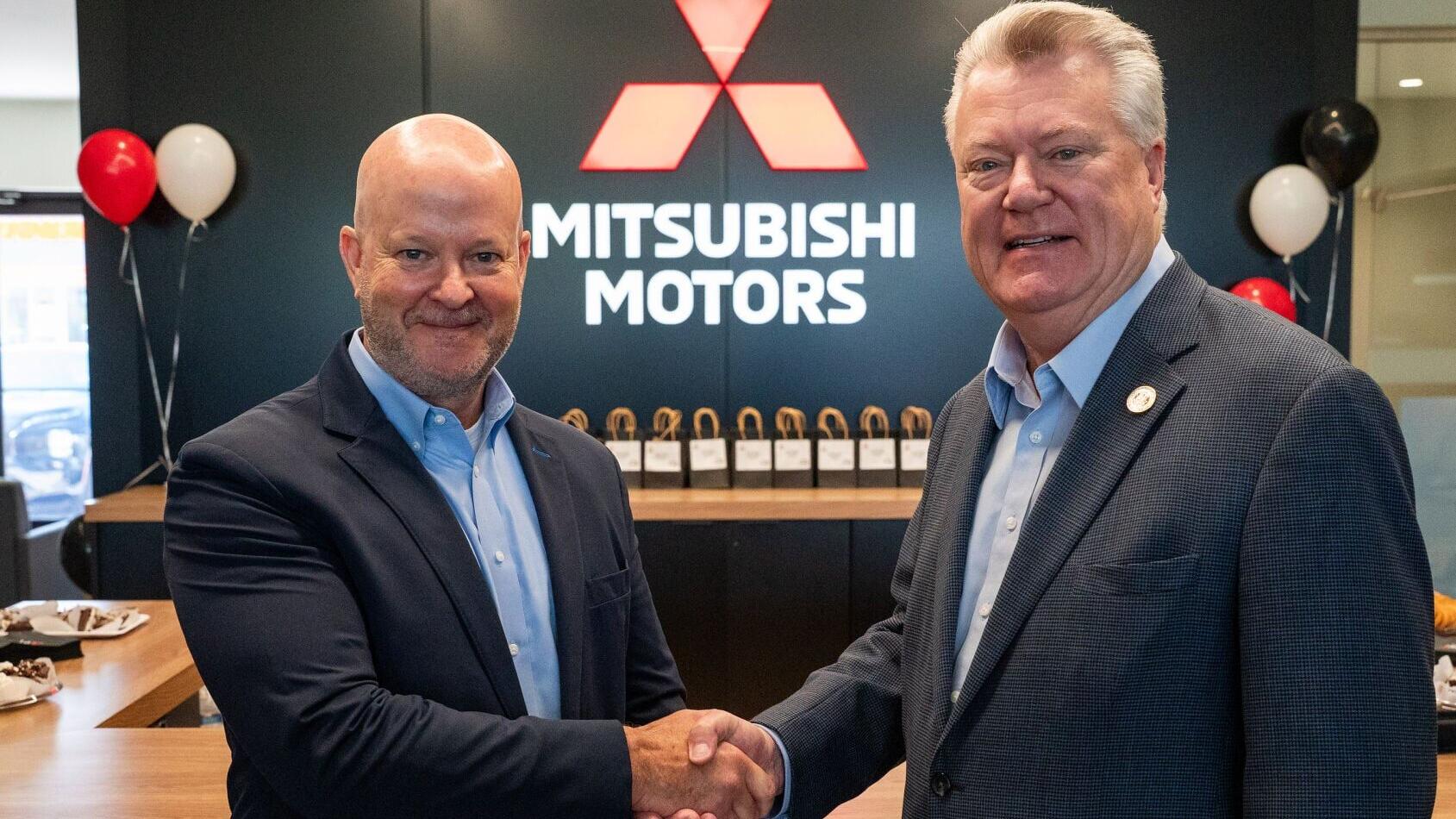 Allen Borden, deputy commissioner, Tennessee Dept of Economic and Community Development (right) congratulates Mark Chaffin, president &amp; CEO, Mitsubishi Motors North America, on the grand opening of Mitsubishi Motors’ first Gallery dealership in the Unit...