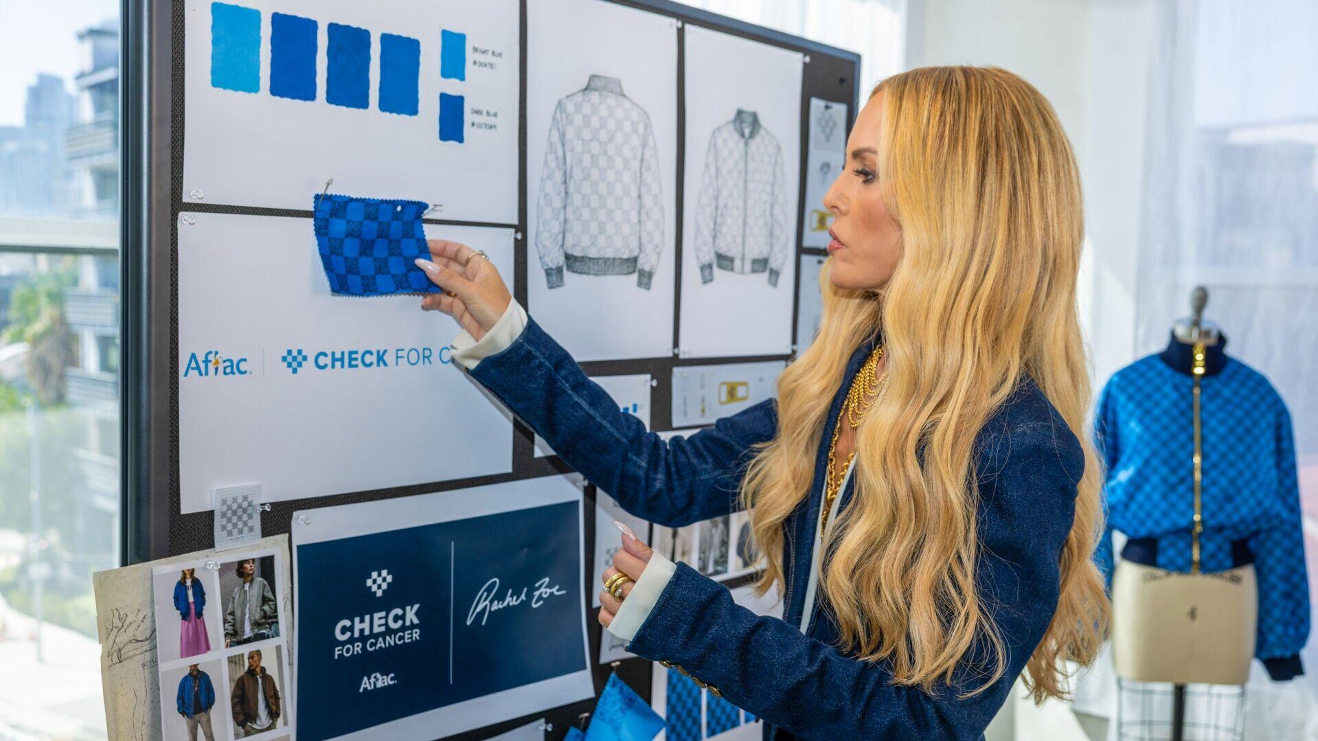 Fashion designer Rachel Zoe works on a limited-edition jacket she designed with Aflac that includes a QR code prompting people to Check for Cancer, because early detection can help save lives.