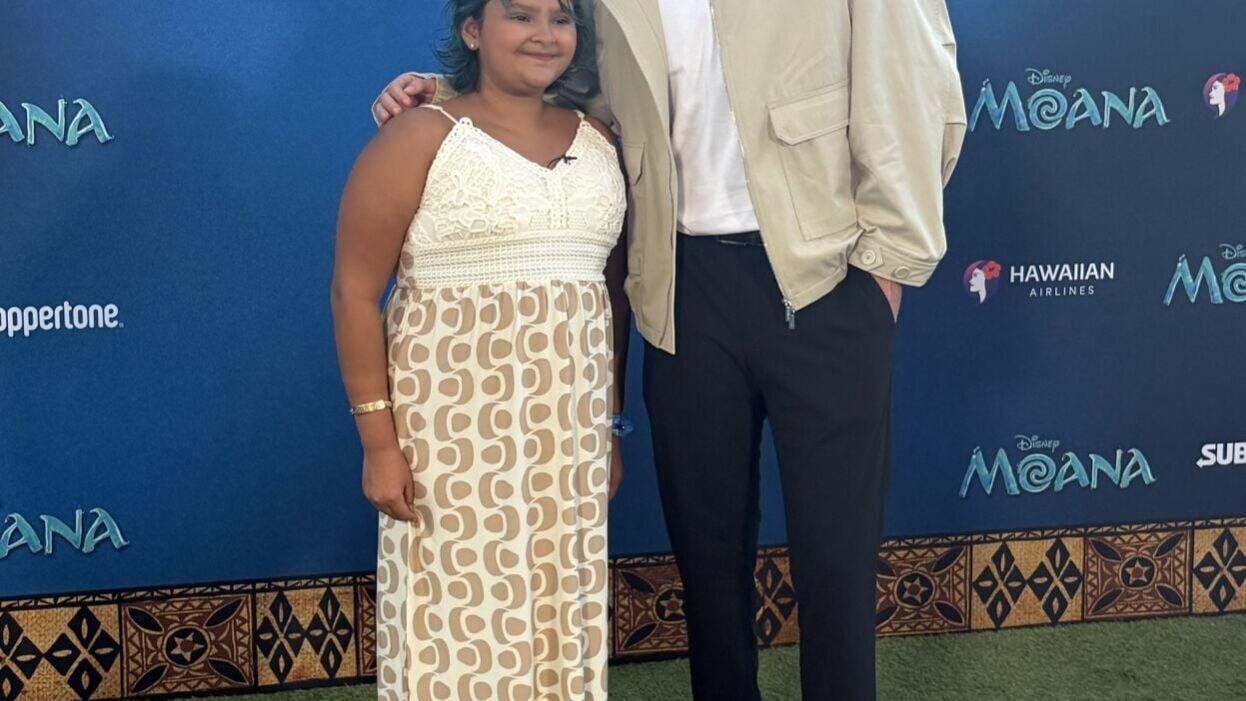 Abby poses with Mr. Beast during the Moana world premiere, made possible through a special collaboration between Little Smiles and Mr. Beast to create unforgettable experiences for children facing serious illness and adversity.