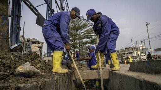 The street cleaners are former gang members drafted into a paramilitary National Service force