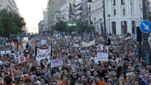 Demonstrators rattled keys and blew whistles as they made their way through central Madrid