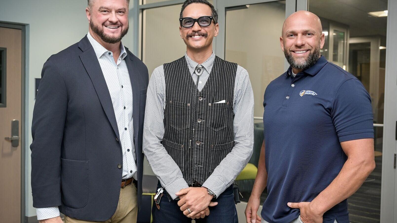 PHOTO (Left to Right): FleetForce CEO Tra Williams, FleetForce Graduate Drexyl Eitniear, and Swift Transportation VP of Recruitment, Kort Chase
