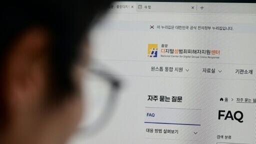 The head of the National Center for Digital Sexual Crime Response Kim Mi-Soon browses through their internal website in Seoul