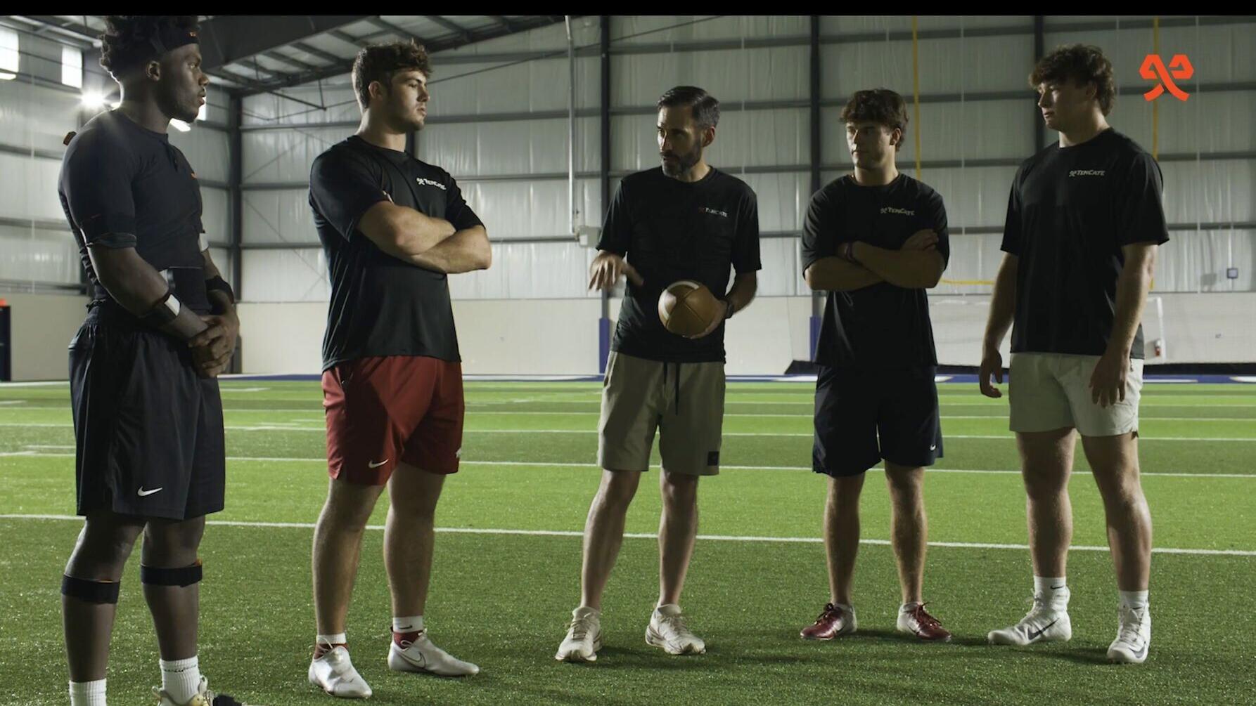 Dr. Colin Young (center) with some of the players whose biometric data helped refine how Pivot Performance Turf delivers traction, release and response under actual playing conditions.