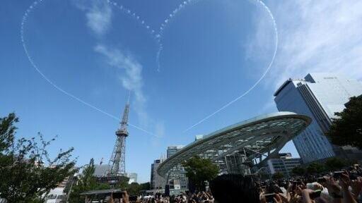 Skywriting in the shape of a heart created by Kawasaki T-4s of the Japan Air Self-Defense Force over Nagoya