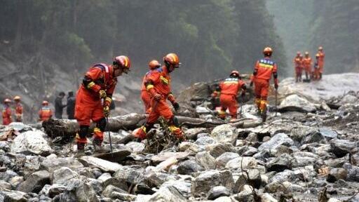 Fire and rescue personnel conduct search and rescue operations 2 kilometers from Gyirong Port days after the August 26 mudslide