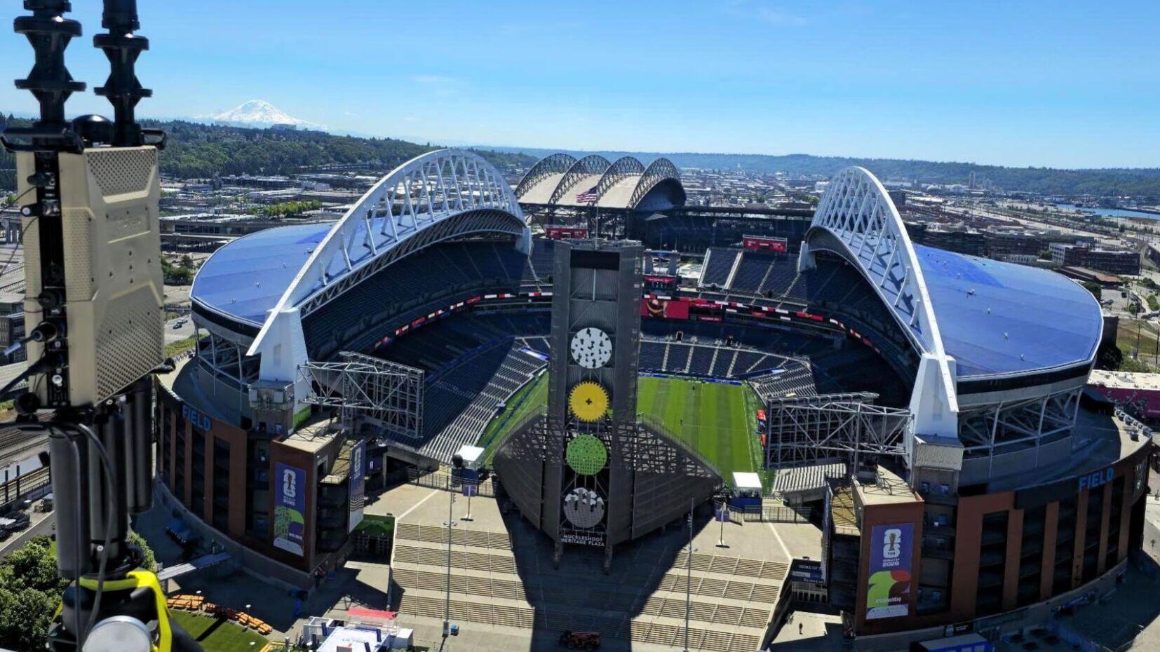 D-Fend Solutions' EnforceAir system deployed overlooking Seattle's host stadium, with Mount Rainier in the background, providing non-kinetic, cyber-driven counter-drone airspace protection during the 2026 FIFA World Cup.