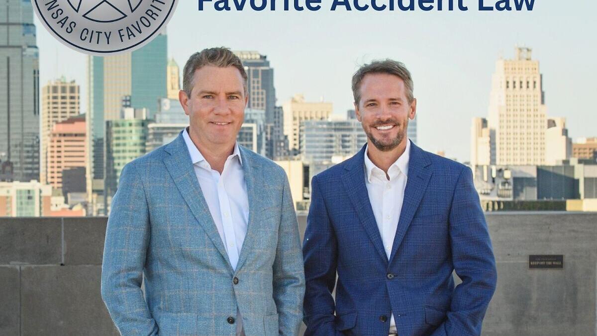 Attorneys Michael Foster and Brian Wallace of Foster Wallace Personal Injury Lawyers celebrate the firm's recognition as a 2026 KC Favorites Silver Winner in the Favorite Trial Law and Favorite Accident Law categories.