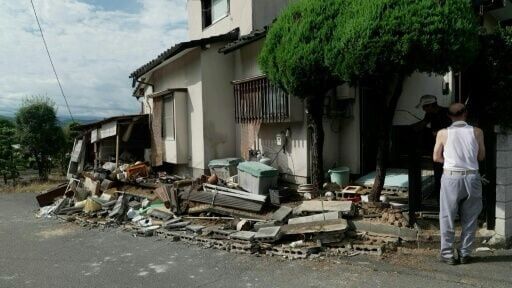 Residents survey damaged homes in Japan's Kumamoto after major quake