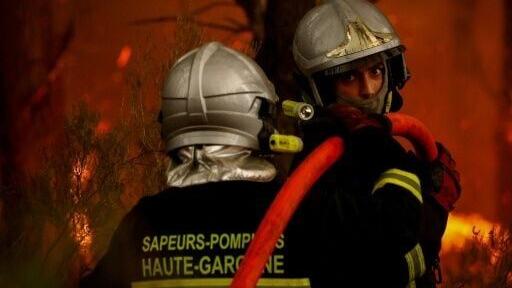 Firefighters battle a blaze in Saint-Jean-d'Illac, some 30km from Bordeaux, on July 26, 2026