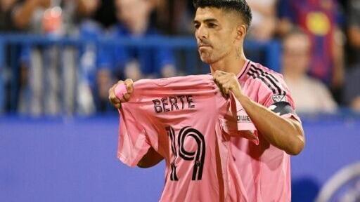 Inter Miami's Luis Suárez holds up the jersey of injured teammate German Berterame after converting the game winning penalty in a 1-0 MLS victory at Montreal
