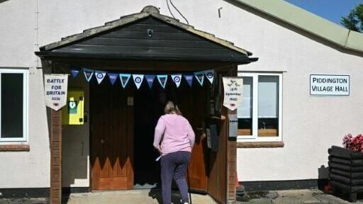 A local resident arrives to vote